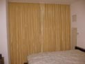 Silk ripple fold curtains for a large bedroom window in Manhattan, NYC